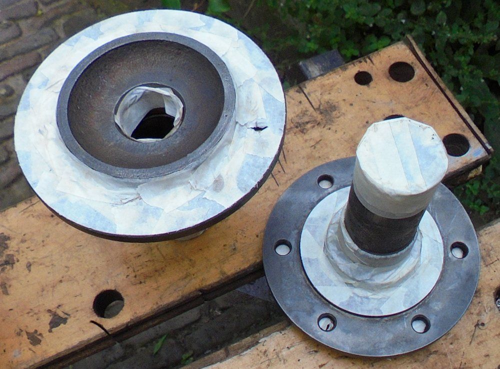 1965 series 2a station wagon front axle stubs masked and ready for paint.JPG