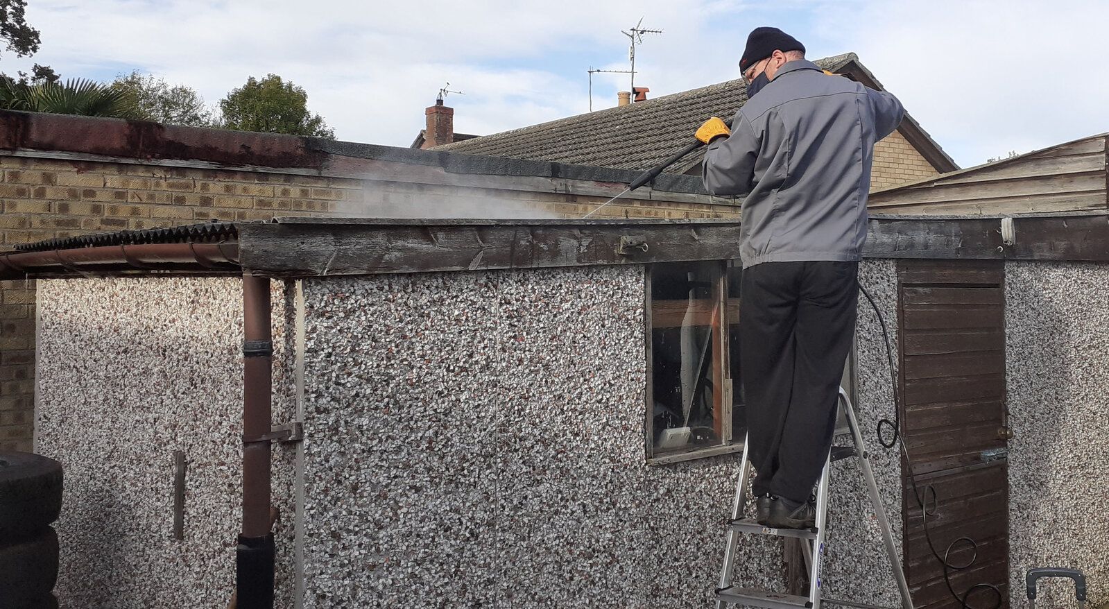 Cleaning garage roof.jpg