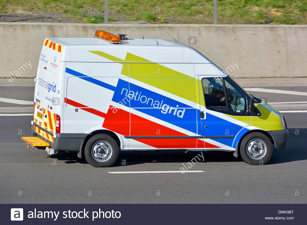 ford-transit-van-operated-by-the-national-grid-driving-along-motorway-DMK98T.jpg