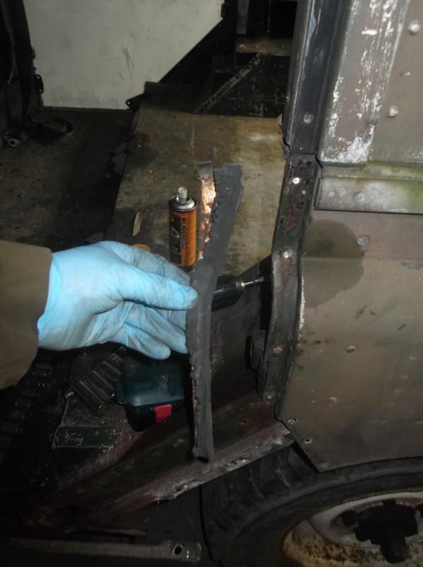 1965 series 2a station wagon drilling off rivets for door seals.JPG